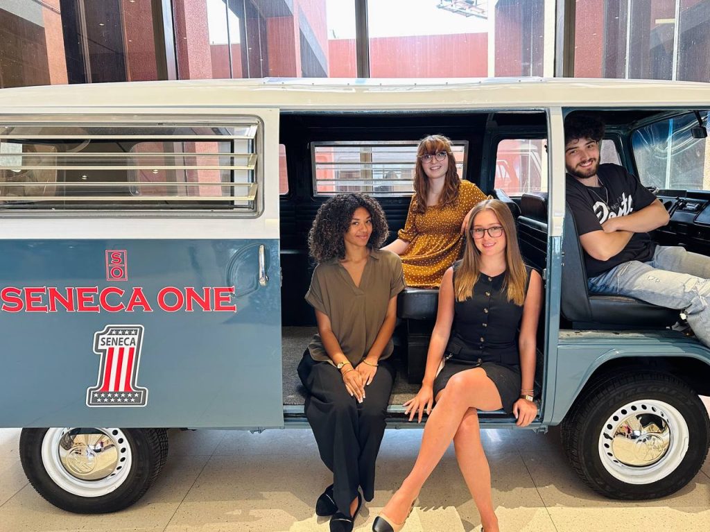 A photo of Twipes' 2024 interns in the Seneca One van